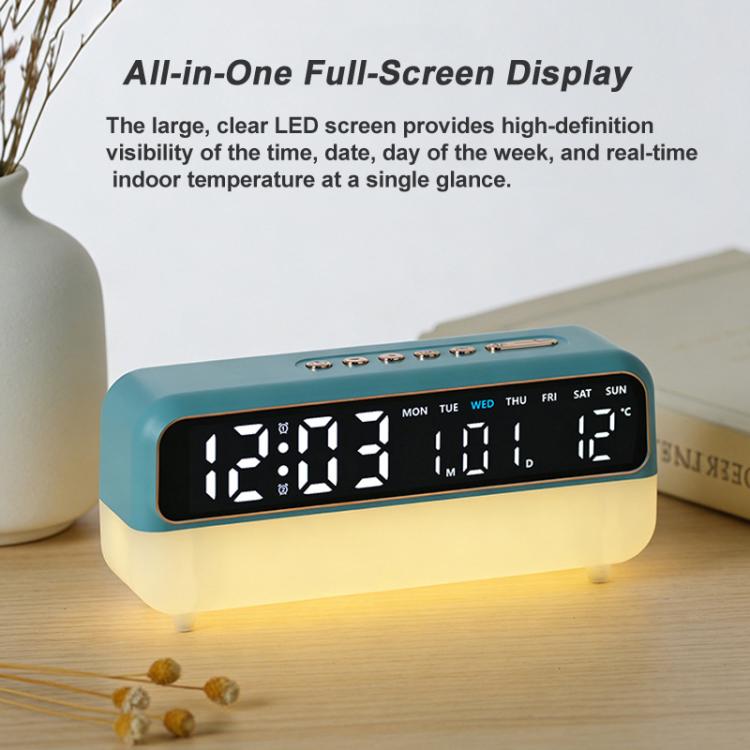 Teal digital alarm clock on desk with LED date and temperature display