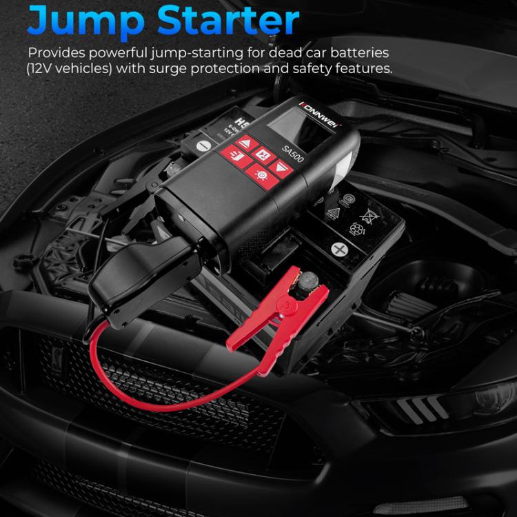 Car jump starter with red battery clamps connected in the engine bay