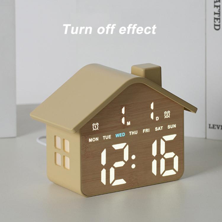 Yellow house-shaped digital alarm clock with illuminated time digits and day-of-week icons