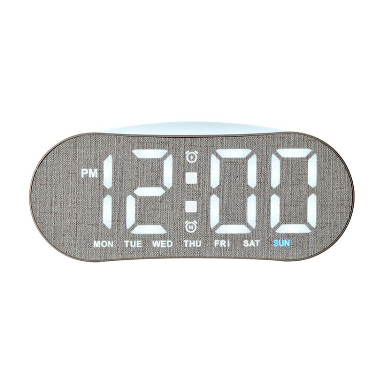 Digital alarm clock with gray fabric shell and white LED time display