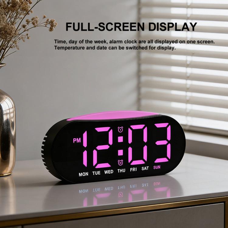 Digital alarm clock with pink LED time and day-of-week display