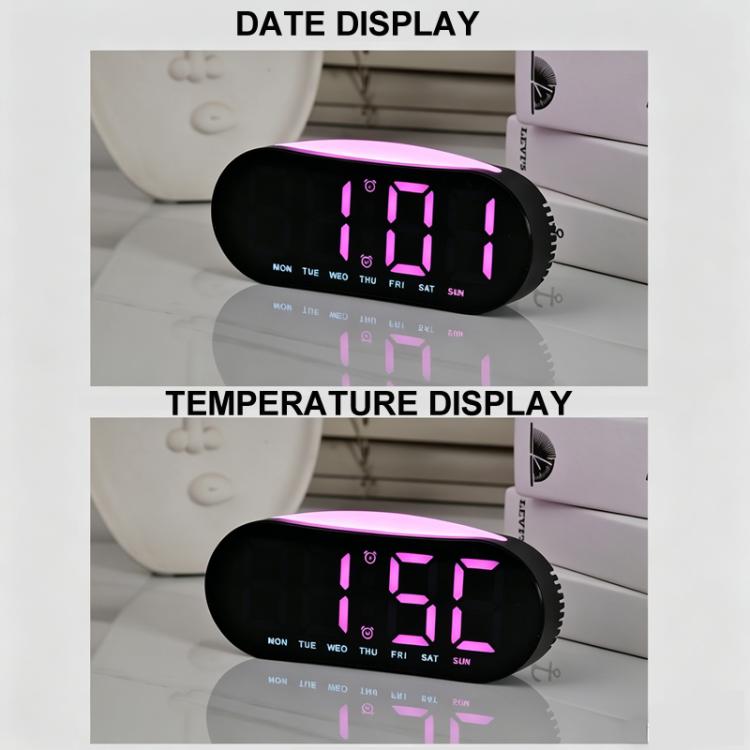 Digital alarm clock showing date and temperature on LED display
