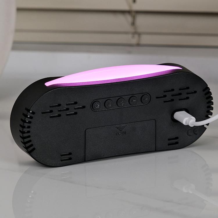 Digital alarm clock with purple LED strip on black base and buttons