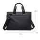 Men's black laptop messenger bag with top handles and adjustable shoulder strap