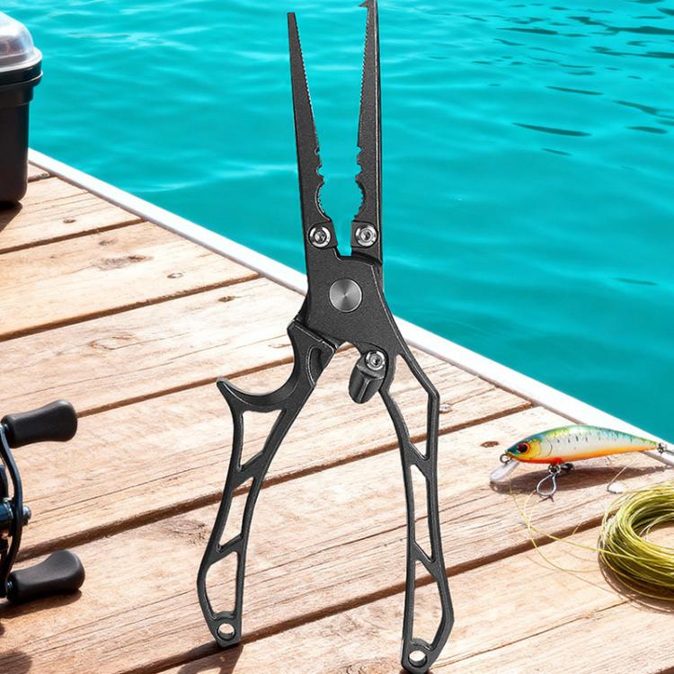 Fishing hook remover pliers gripping a lure, dark metal, hollow handle.