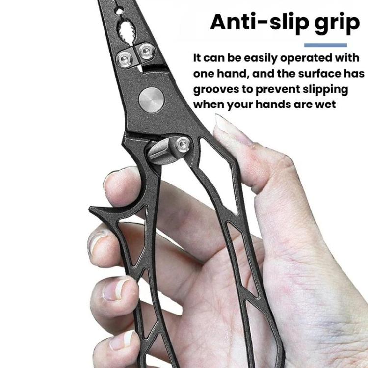 Fishing hook remover pliers with anti-slip grip, dark metal, held in hand.