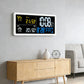 Digital wall clock weather station with LCD showing time and indoor/outdoor temperature readings.