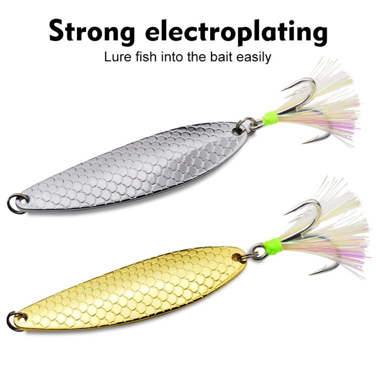 Metal fishing spoon lures, silver and gold, with feather tails and treble hooks