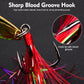 Close-up willow leaf spoon lure: gold blade with red tinsel and treble hook