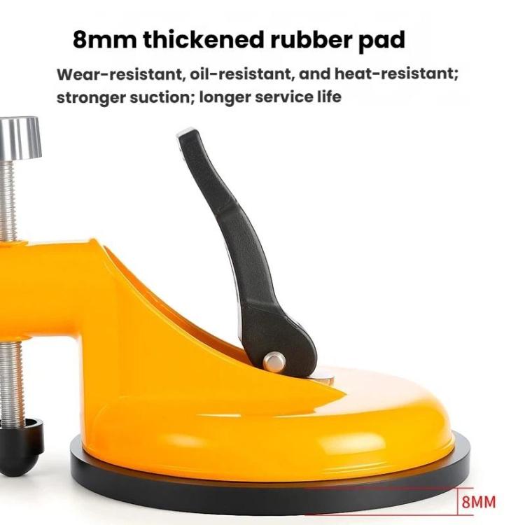Orange tile leveling suction cup with black rubber pad and black clamp handle
