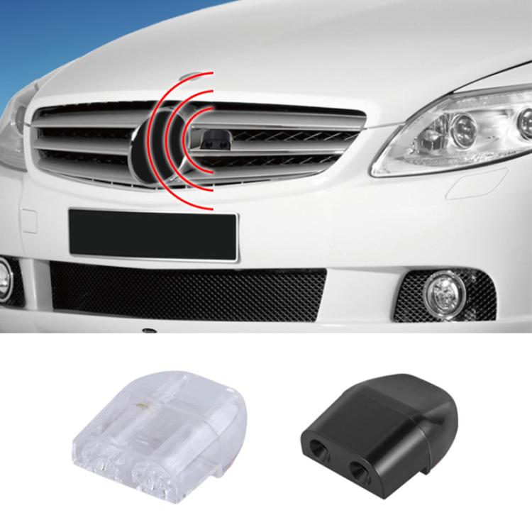 Car grille-mounted alarm kit with black and transparent sensor units shown.