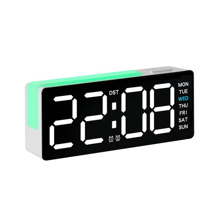 Digital alarm clock with RGB night light, white time digits with DST and weekday panel.