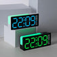Two digital alarm clocks on steps, one blue and one green display, RGB night light.