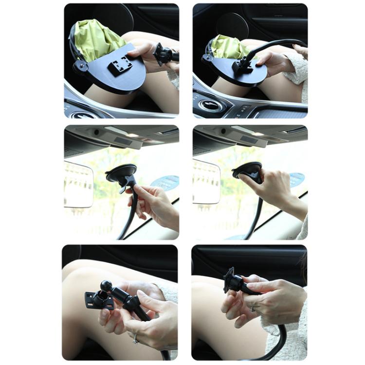Car sunshade being attached to window with suction cup stand and hand mounting