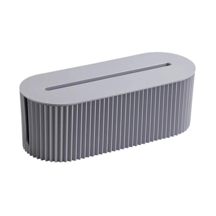 Desktop wire management cable box with open top slot, gray ribbed body and rounded top.