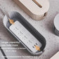 Desktop power socket cable box interior with outlet strip inside ribbed channel.