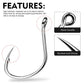 Close-up of one shiny silver fish hook with ring eye and barbed sharp point