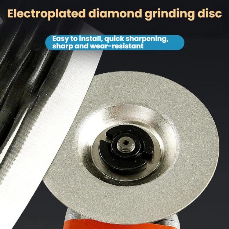 Grinding disc mounted on an angle grinder head, silver-gray abrasive face with center hub