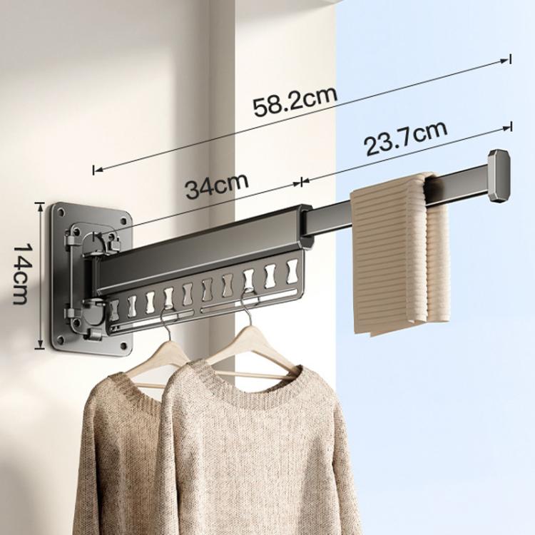 Wall-mounted folding clothes drying rack with dark grey frame and hanging pegs
