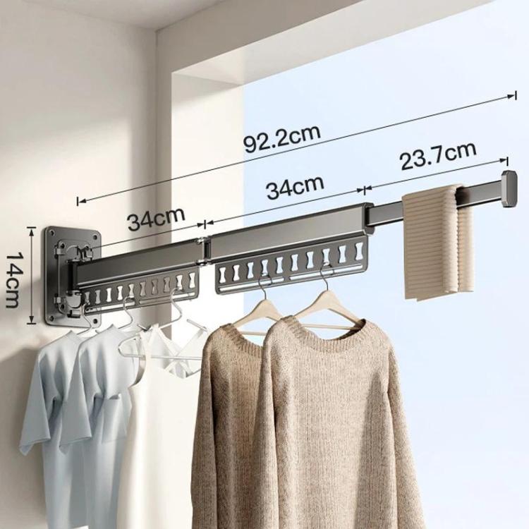 Extended wall-mounted clothes drying rack with dark grey rods and hanging clips