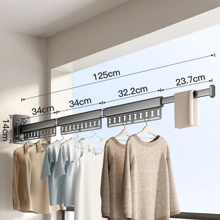 Long wall-mounted clothes drying rack with dark grey frame, pegs, and clips