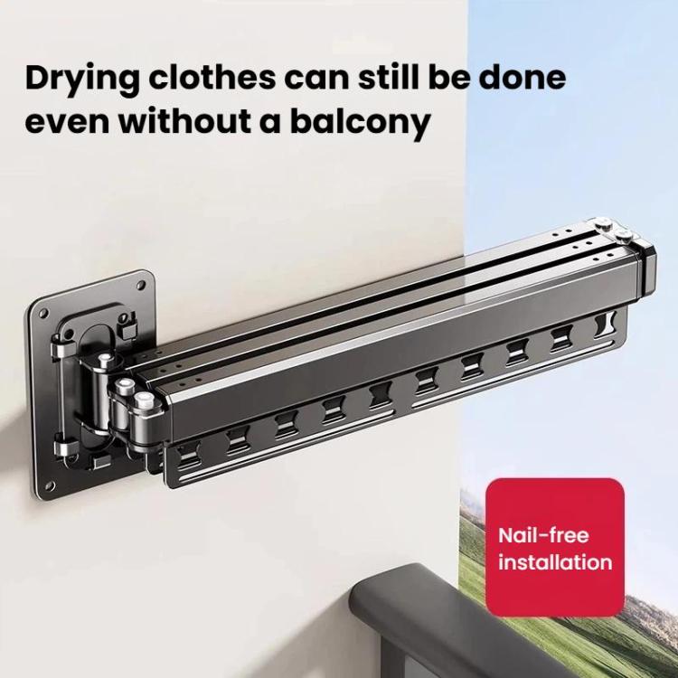 Nail-free wall-mounted drying rack with dark grey frame and fold-out bar