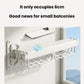 Compact white wall-mounted drying rack with wavy hang bars, low-profile design