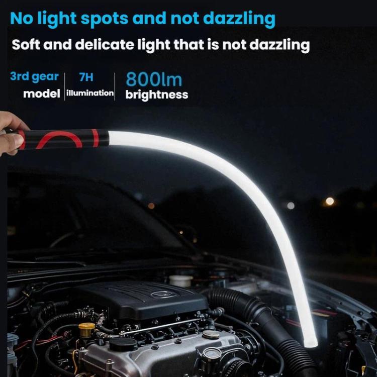 Handheld flexible LED light strip illuminating a car engine bay with a bright white arc