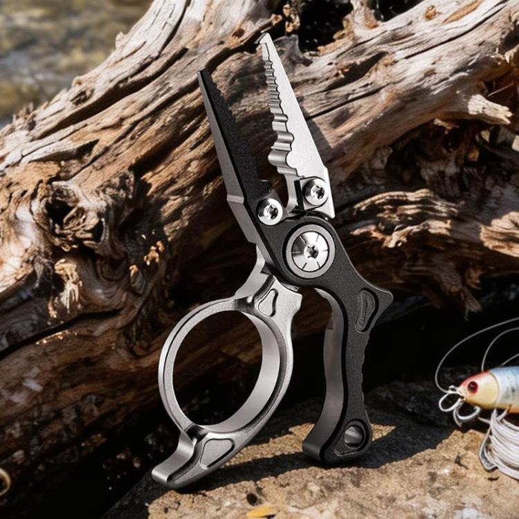 Mini fishing line cutter pliers with open ring and serrated jaws, black and silver.