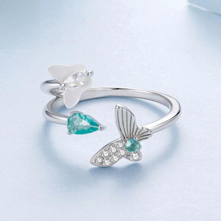 Silver double-layer butterfly ring with green teardrop stone and clear accents