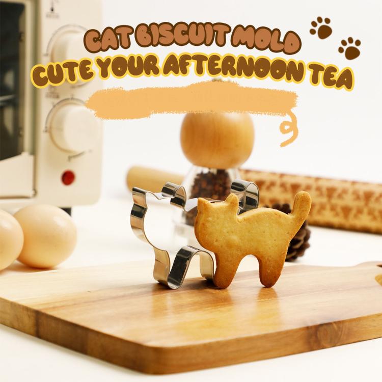 Cat-shaped stainless steel cookie cutter holding a baked cat cookie on a board