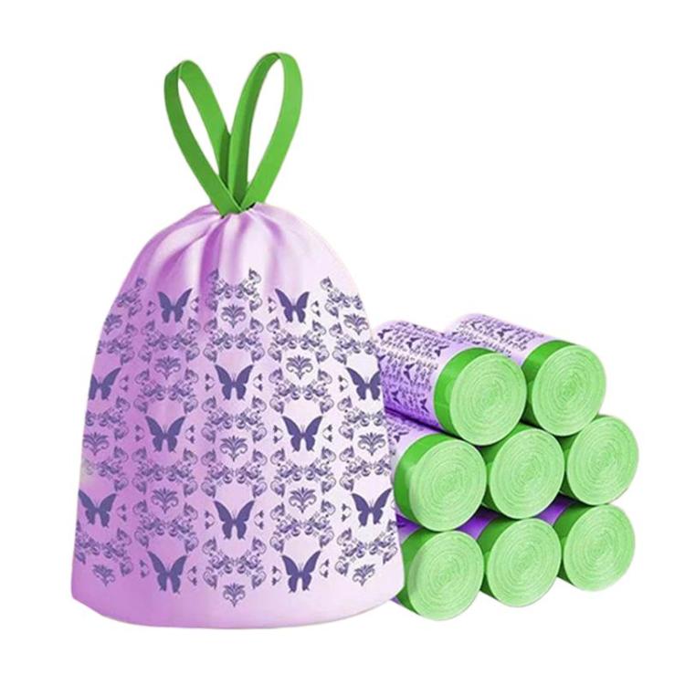 Lavender drawstring trash bag with butterflies pattern; roll of green bags