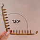 Brown banana hair clip with metal prongs, curved for securing hair volume