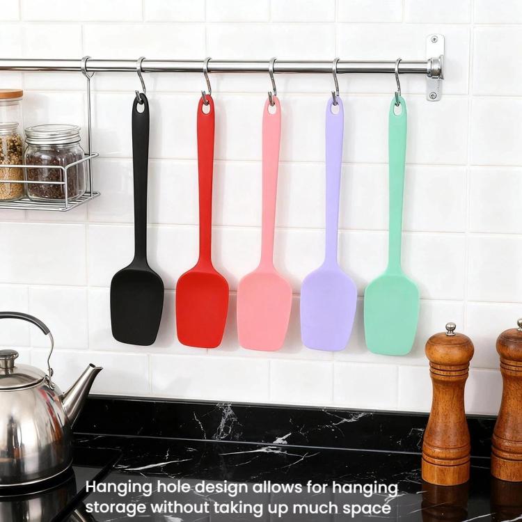 Hanging silicone spatulas in black, red, pink, purple, and mint with loop handles