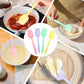 Silicone spatulas spreading cake batter and scooping flour-dusted ingredients