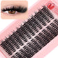 Curled black eyelash clusters and false lashes on tray, with model eye detail