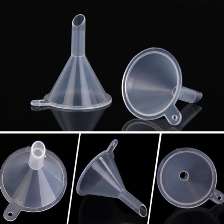 Set of clear plastic mini funnels with short spouts and rim handles