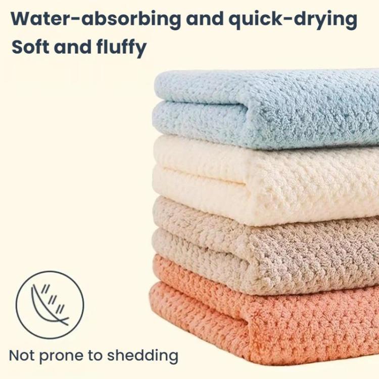 Stack of pastel coral fleece drying cloths in assorted colors