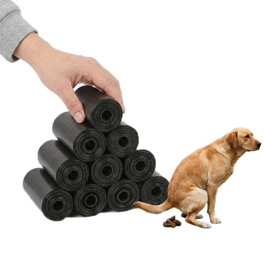 Portable outdoor pet trash bag roll: stacked dark gray rolls held in hand