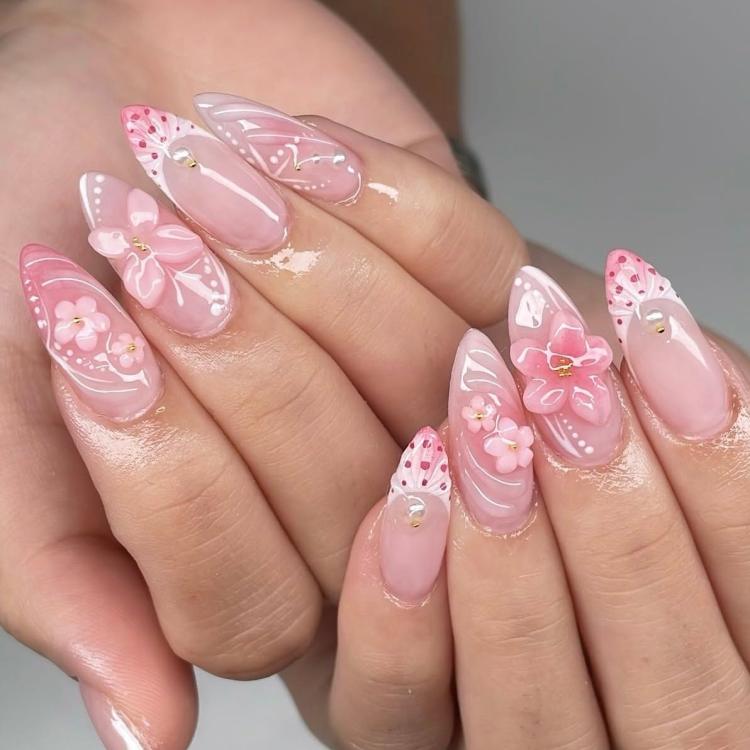 Pink ombre almond fake nails with 3D flowers, bows, and dot detailing