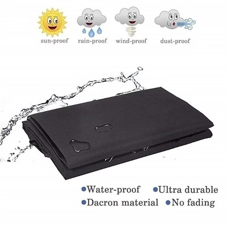 Folded black BBQ grill cover with handles and storage straps
