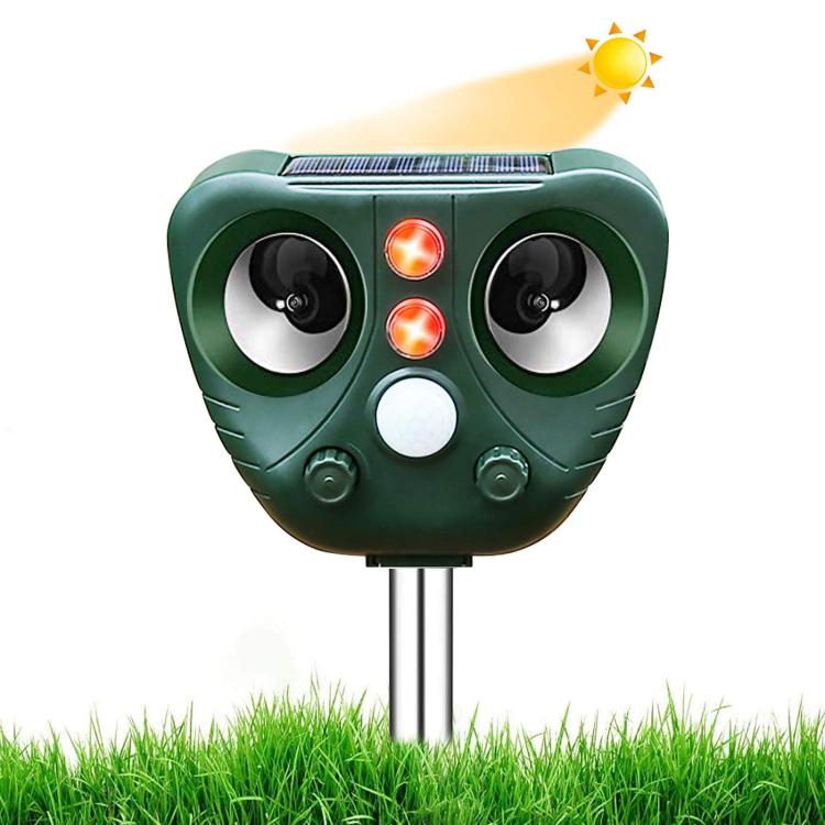 Green solar ultrasonic animal repeller with two speaker-style side vents and indicator lights