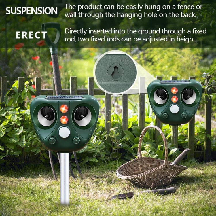 Green solar ultrasonic animal repeller mounted outdoors with adjustable stake