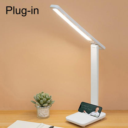 LED folding desk lamp with white light bar on a stable base