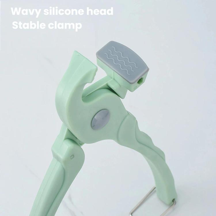 Non-slip silicone head and stable clamp arms on mint green bowl tongs