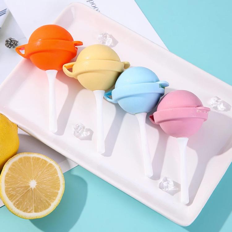 Ice pop mold tray holding several pastel lollipop-shaped silicone molds with white sticks