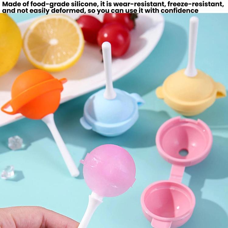 Silicone ice pop molds in pink, blue, orange, and yellow with white sticks