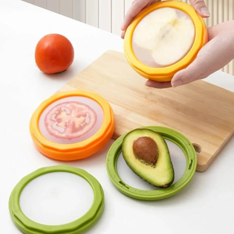 LsCook transparent round food containers with orange and green lids, holding sliced produce