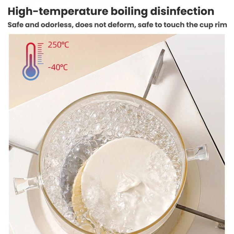 Transparent cup of hot water covered with a white silicone lid