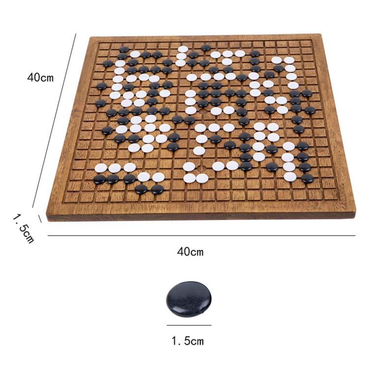 Square wooden go board with black and white stones, with one loose piece shown